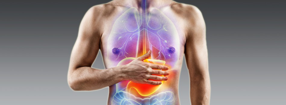 Digestion issue. Man holding his hand in area stomach. Medical concept.
