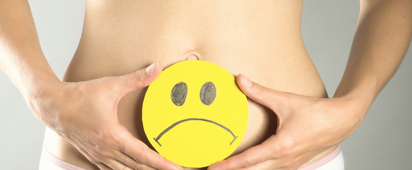 Conceptual photo of female abdominal pain illustrated by emoticons